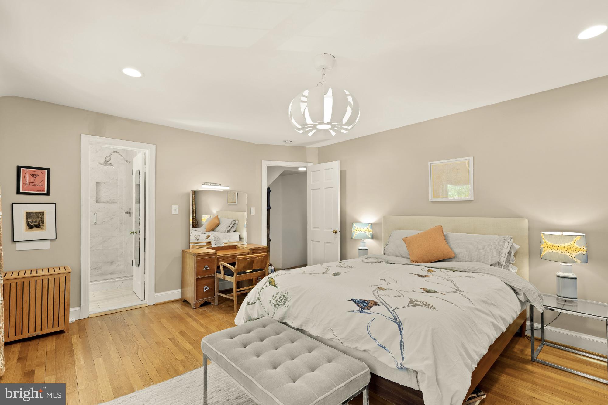 7208 Delfield Street Chevy Chase, MD 20815 - Photo 24 of 50 a bedroom with a bed and wooden floor