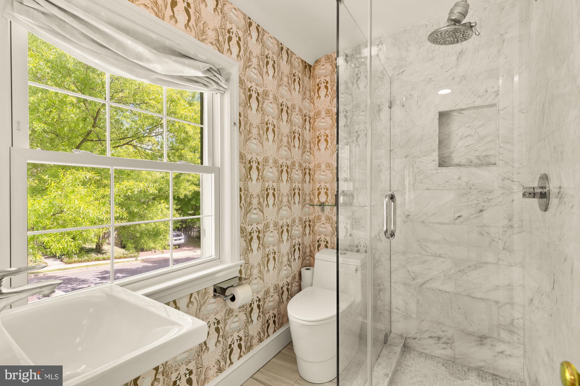 7208 Delfield Street Chevy Chase, MD 20815 - Photo 25 of 50 a bathroom with a sink toilet and shower