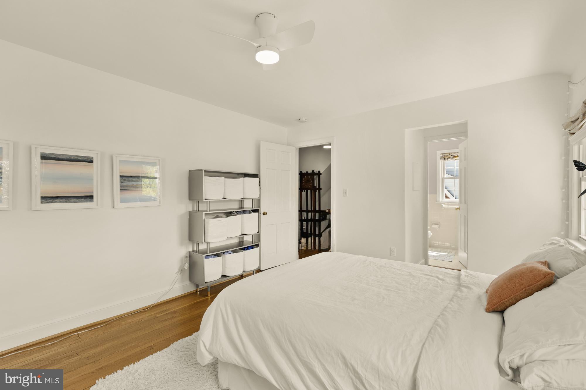 7208 Delfield Street Chevy Chase, MD 20815 - Photo 29 of 50 a bedroom with a bed and cabinets