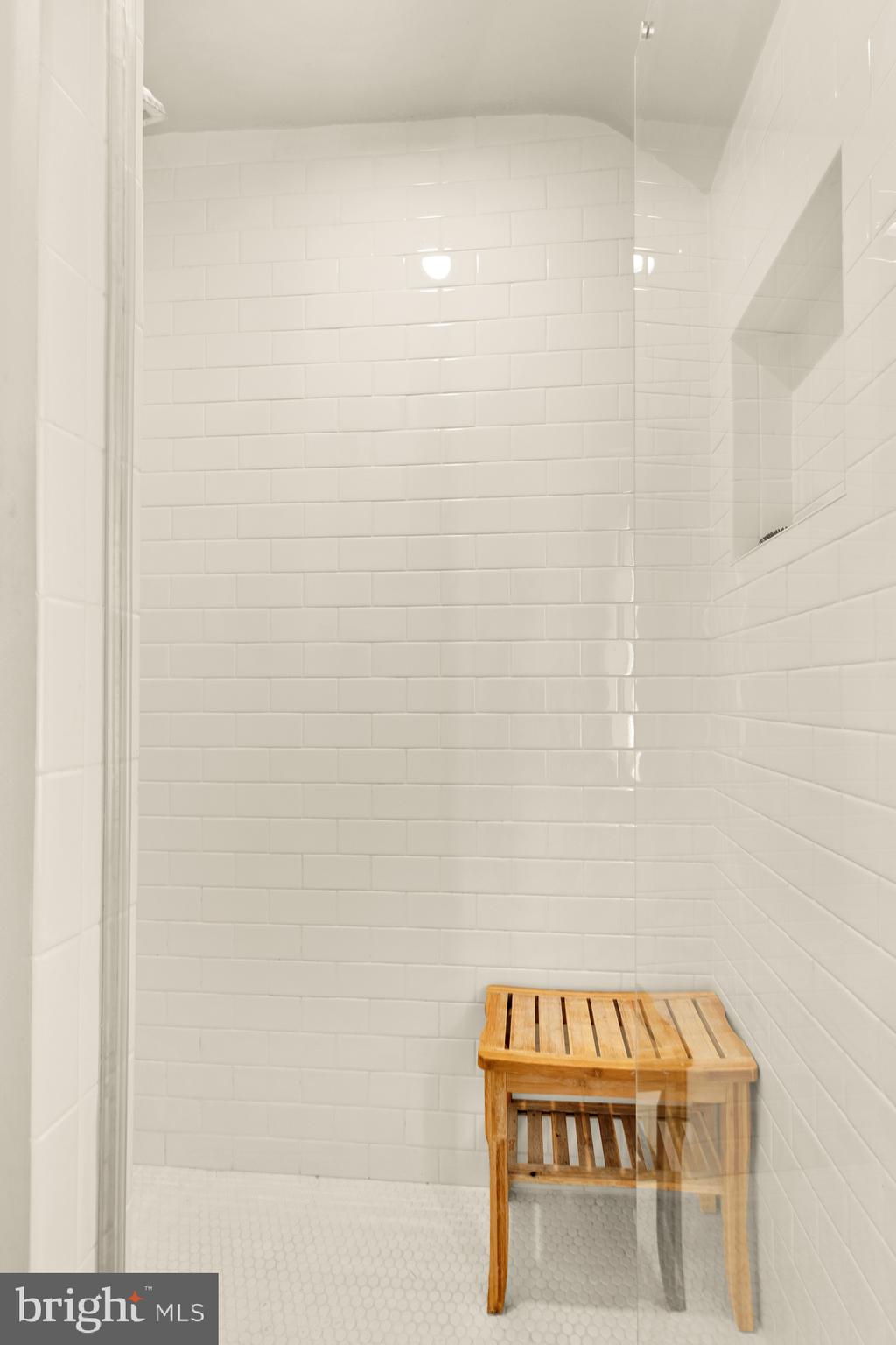 7208 Delfield Street Chevy Chase, MD 20815 - Photo 35 of 50 a bathroom with a bathtub and a shower