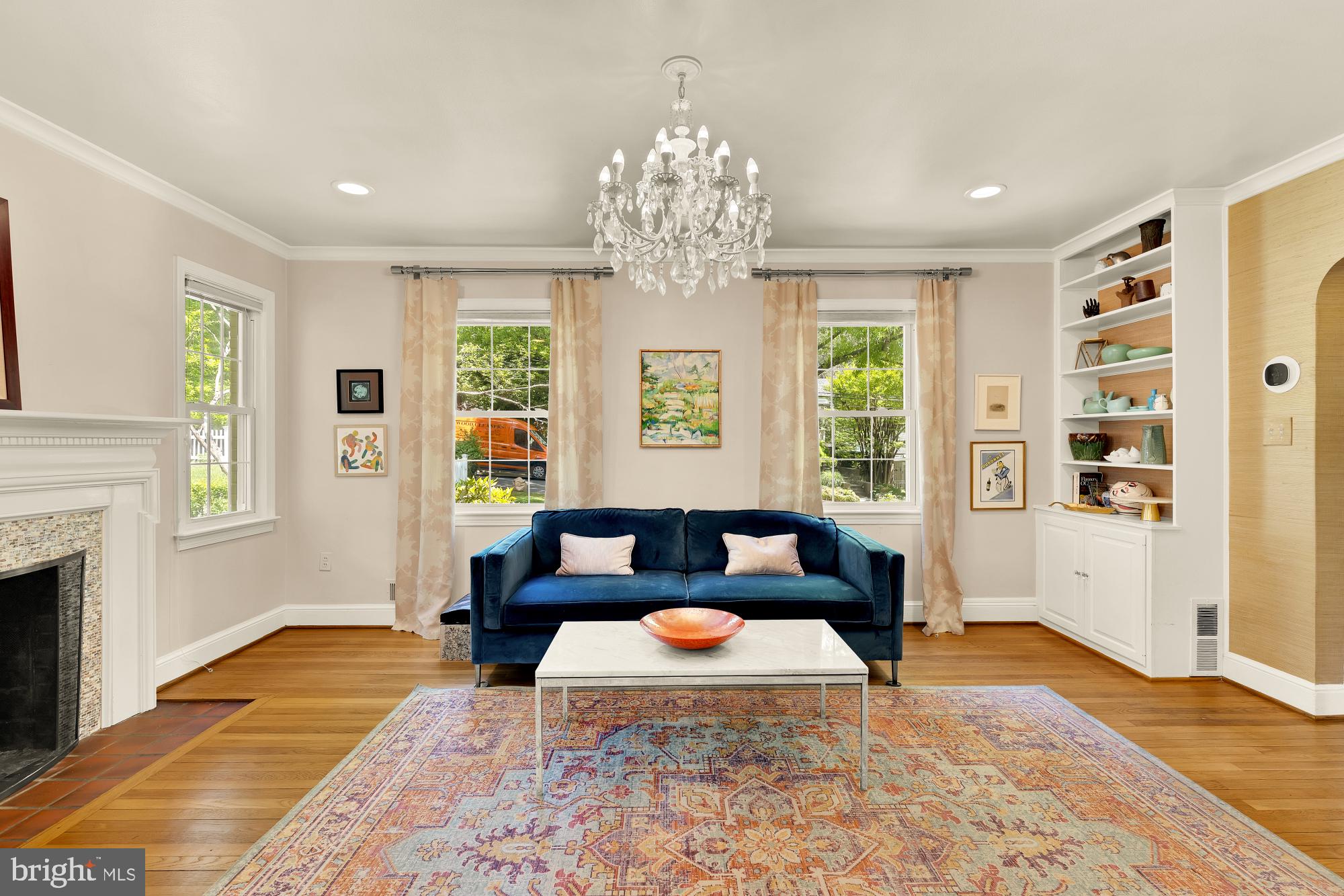 7208 Delfield Street Chevy Chase, MD 20815 - Photo 5 of 50 a living room with furniture and a chandelier