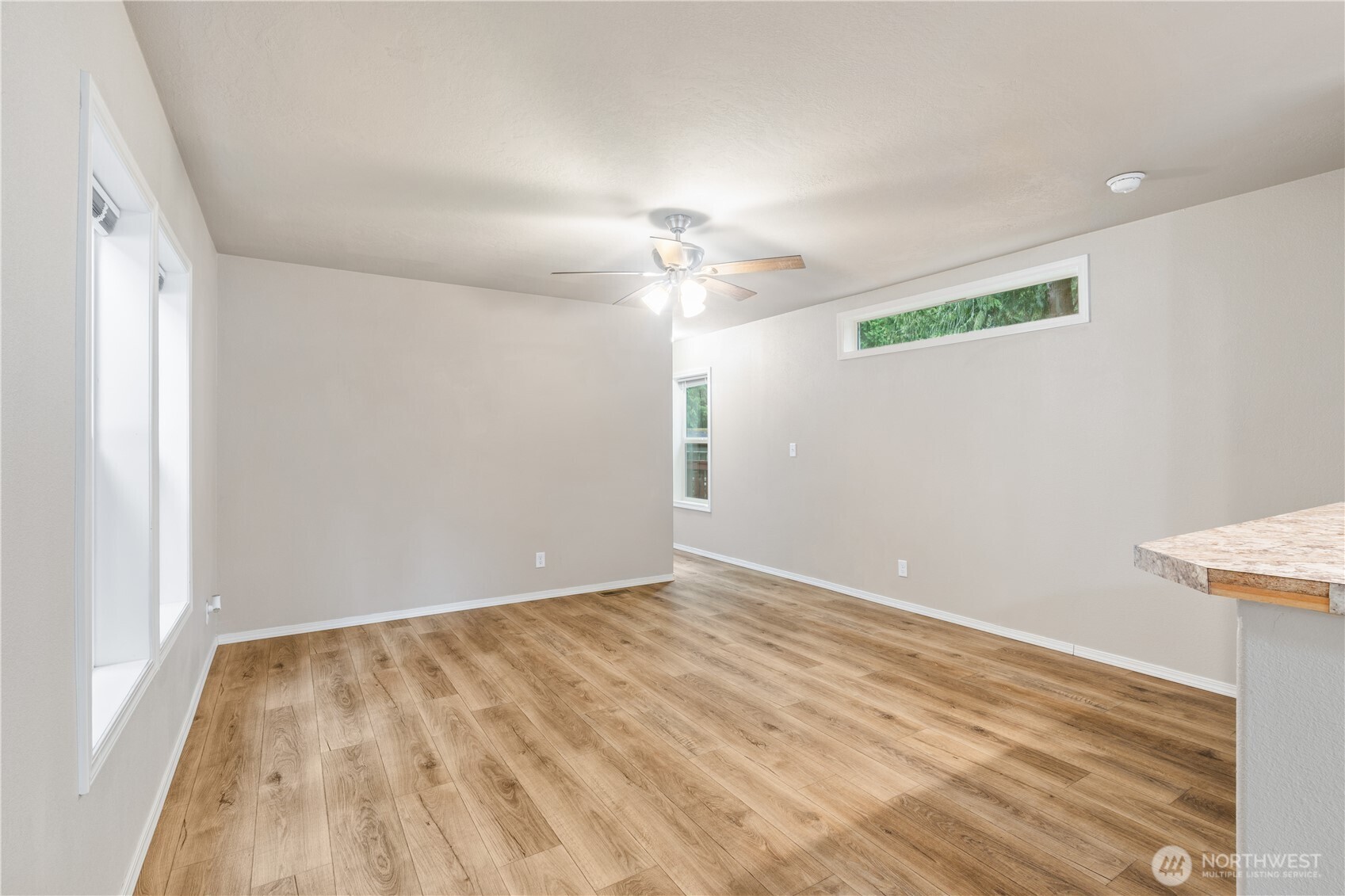 3557 Cedarville Road, Unit 25 Bellingham, WA 98226 - Photo 13 of 29 wooden floor in an empty room with a window