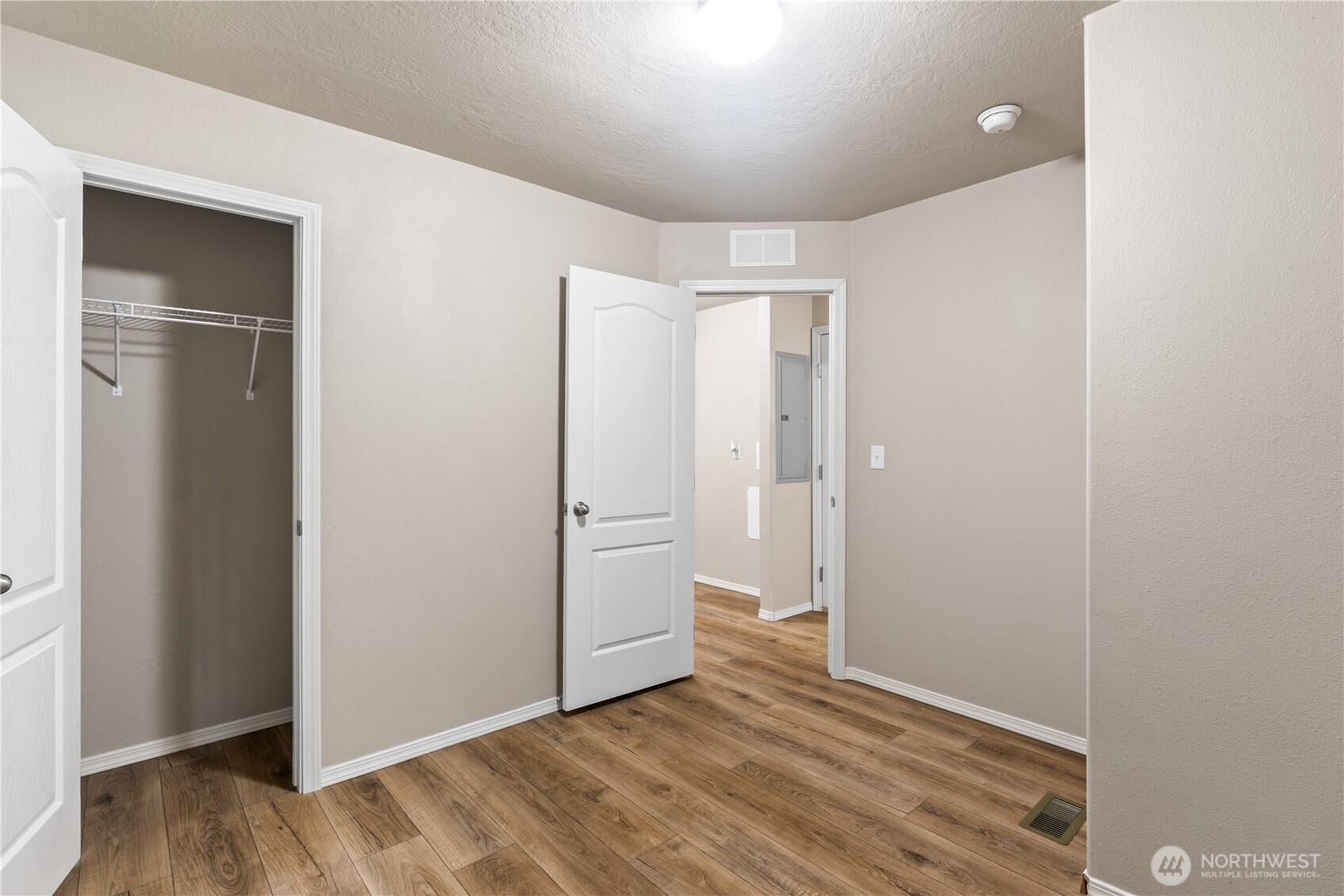 3557 Cedarville Road, Unit 25 Bellingham, WA 98226 - Photo 18 of 29 a view of an empty room with closet and wooden floor