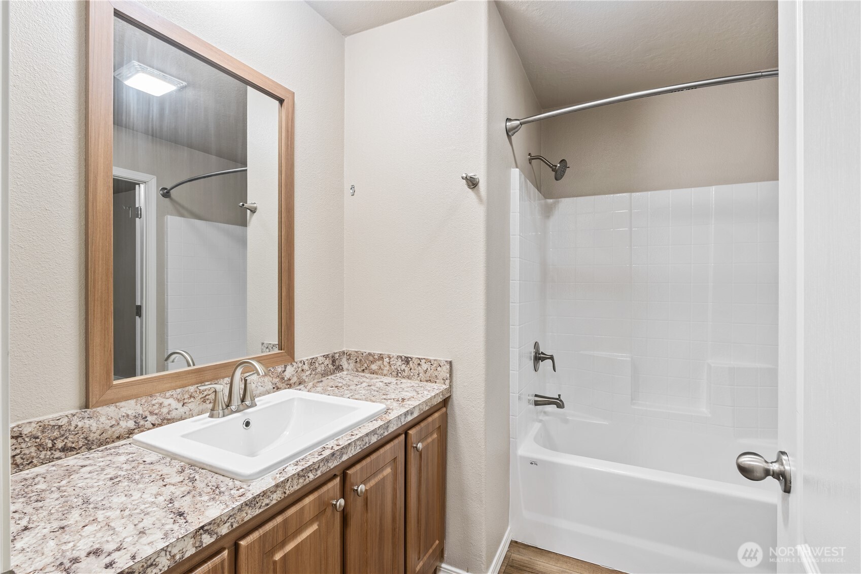 3557 Cedarville Road, Unit 25 Bellingham, WA 98226 - Photo 19 of 29 a bathroom with a granite countertop sink mirror toilet and bathtub