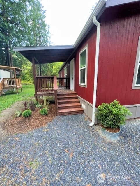 3557 Cedarville Road, Unit 25 Bellingham, WA 98226 - Photo 2 of 29 a backyard of a house with plants and outdoor seating