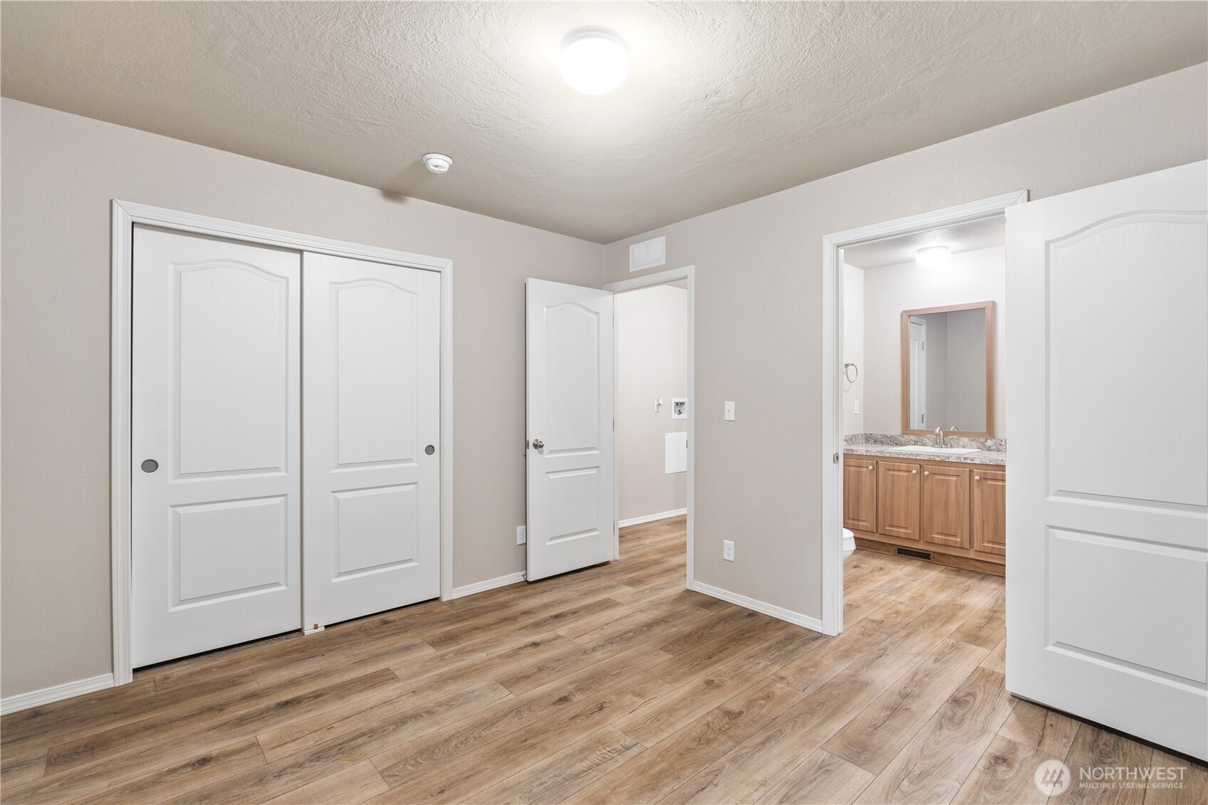 3557 Cedarville Road, Unit 25 Bellingham, WA 98226 - Photo 22 of 29 wooden floor with white walls