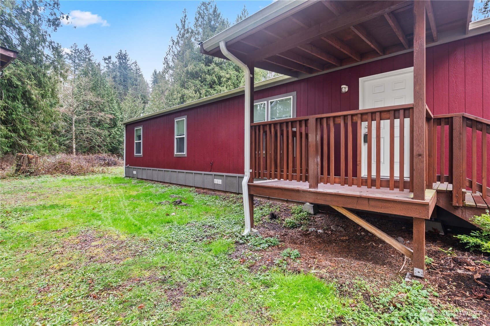 3557 Cedarville Road, Unit 25 Bellingham, WA 98226 - Photo 26 of 29 a backyard of a house with a garden and deck