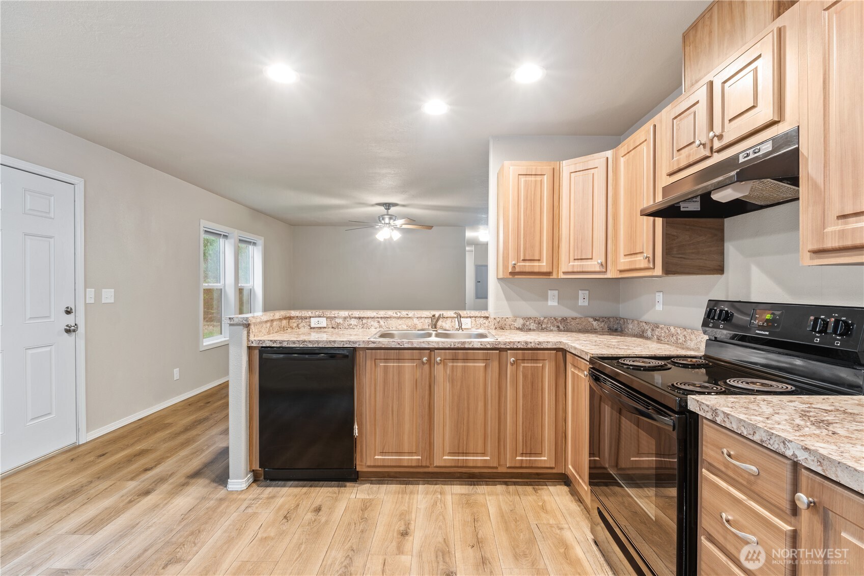 3557 Cedarville Road, Unit 25 Bellingham, WA 98226 - Photo 4 of 29 a kitchen with stainless steel appliances granite countertop a stove and a sink