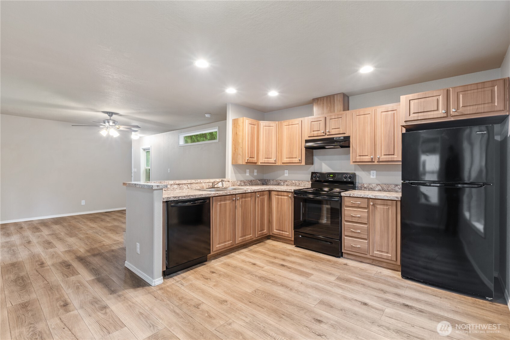 3557 Cedarville Road, Unit 25 Bellingham, WA 98226 - Photo 5 of 29 a kitchen with a refrigerator stove and oven