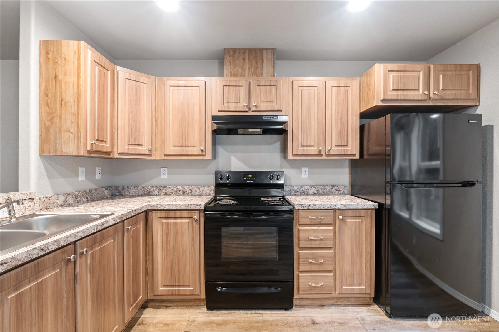 3557 Cedarville Road, Unit 25 Bellingham, WA 98226 - Photo 6 of 29 a kitchen with a stove and a refrigerator