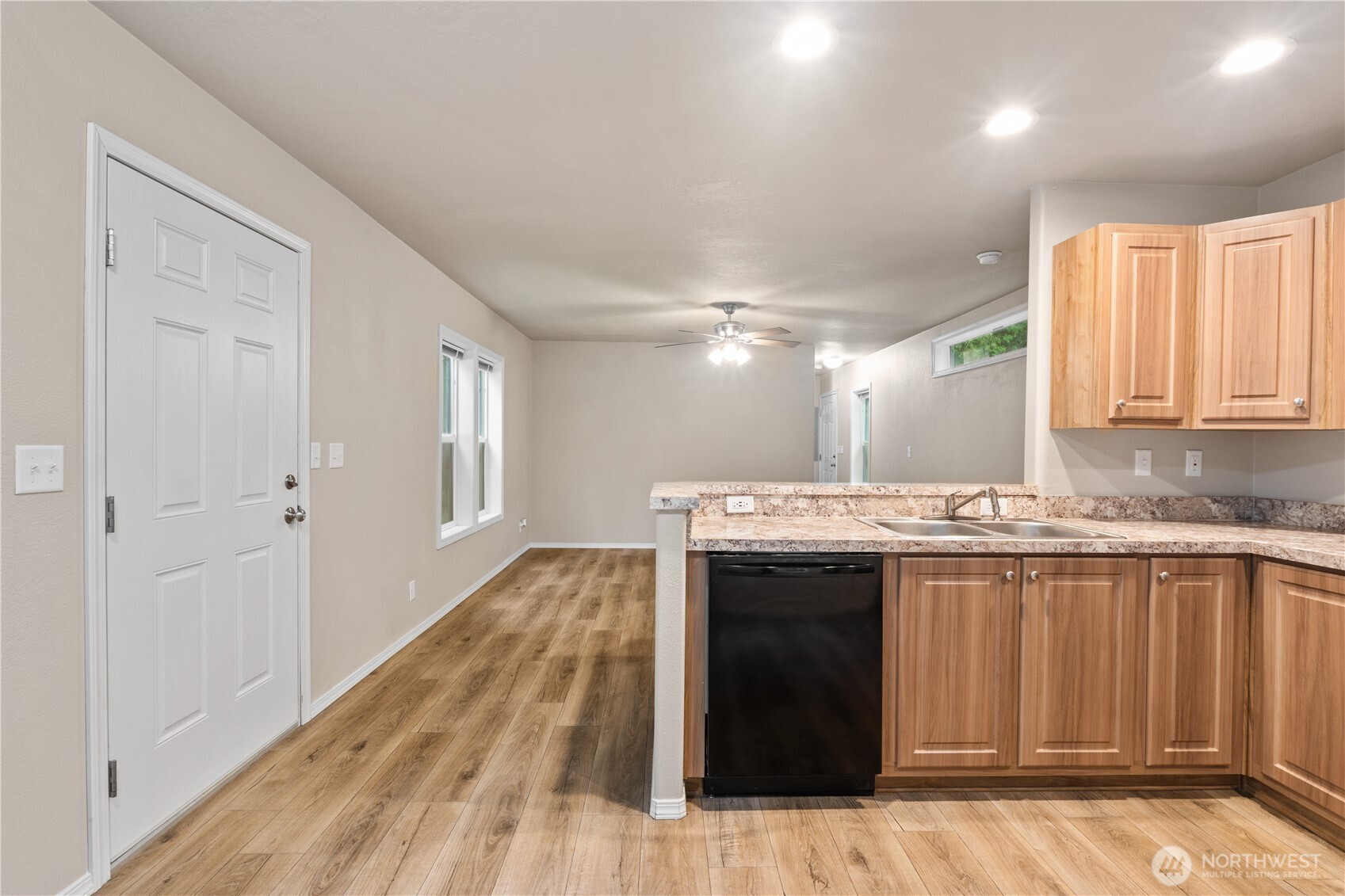 3557 Cedarville Road, Unit 25 Bellingham, WA 98226 - Photo 9 of 29 a view of a kitchen with a sink and wooden floor