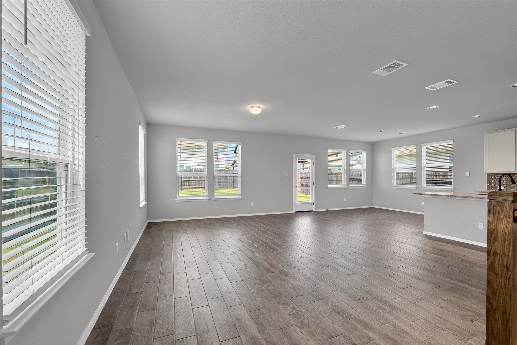 101 Crescent Street Georgetown, TX 78626 - Photo 5 of 39 Living area with a cohesive flow between lounge, dining, and kitchen zones.