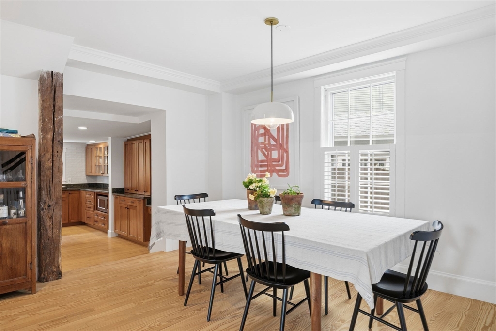 33 Franklin Street Marblehead, MA 01945 - Photo 11 of 42 a view of a dining room with furniture window and wooden floor