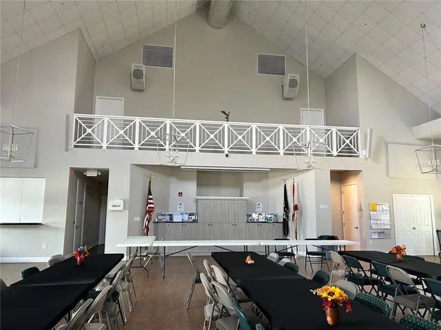 a living room with lots of furniture and a fireplace