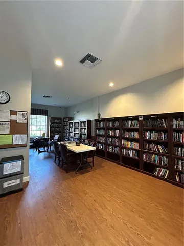 a patio with a table and chairs under an umbrella