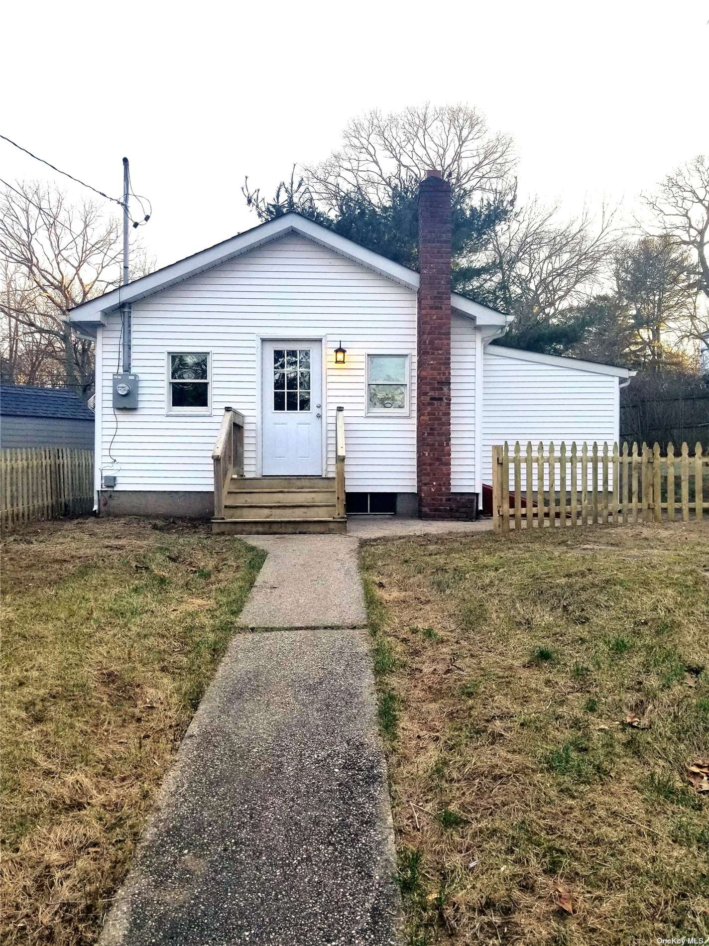 18 Garden Road Sound Beach, NY 11789 - Photo 1 of 1 a view of a white house with a yard