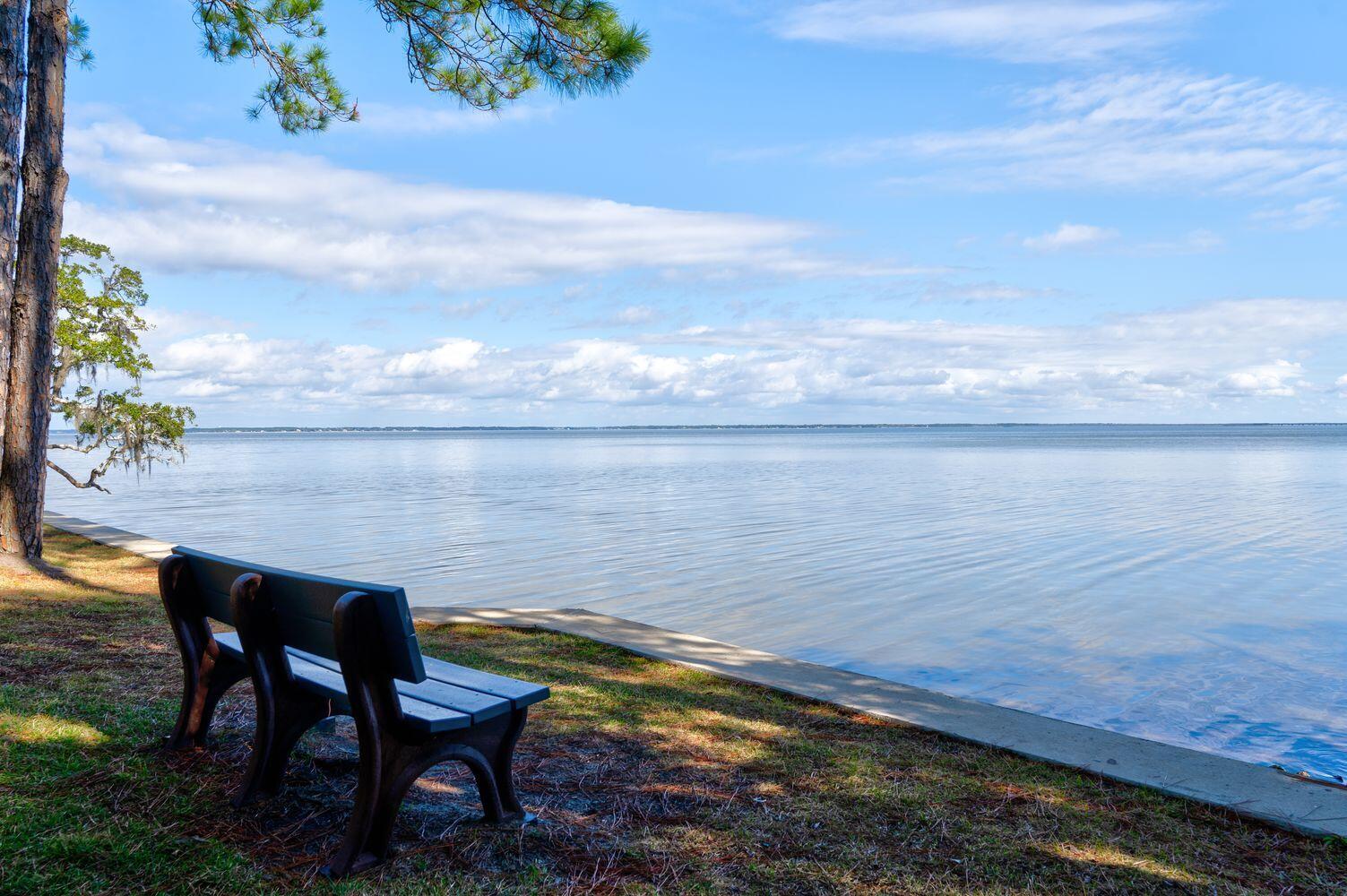 Lot 15 Carolyn Lane Santa Rosa Beach, FL 32459 - Photo 18 of 19 a view of a lake with table and chairs