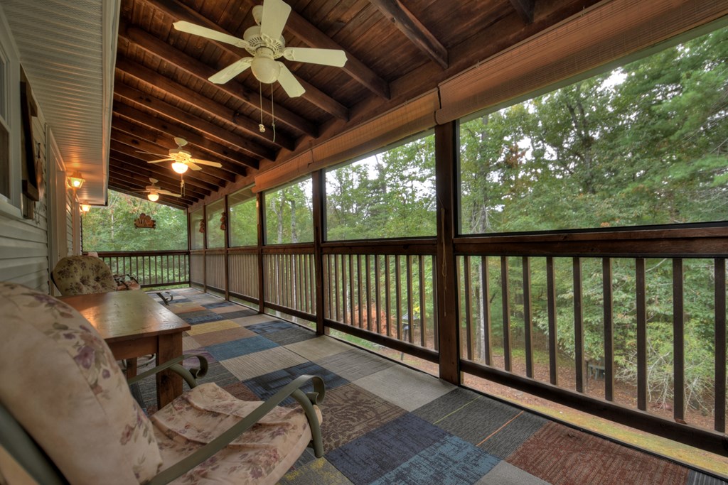 97 Mill Creek Acres Blue Ridge, GA 30513 - Photo 13 of 33 a view of balcony with wooden floor and outdoor seating