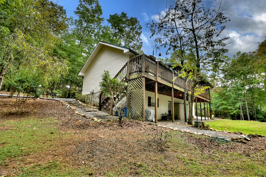 97 Mill Creek Acres Blue Ridge, GA 30513 - Photo 19 of 33 a view of a house with a tree in the background