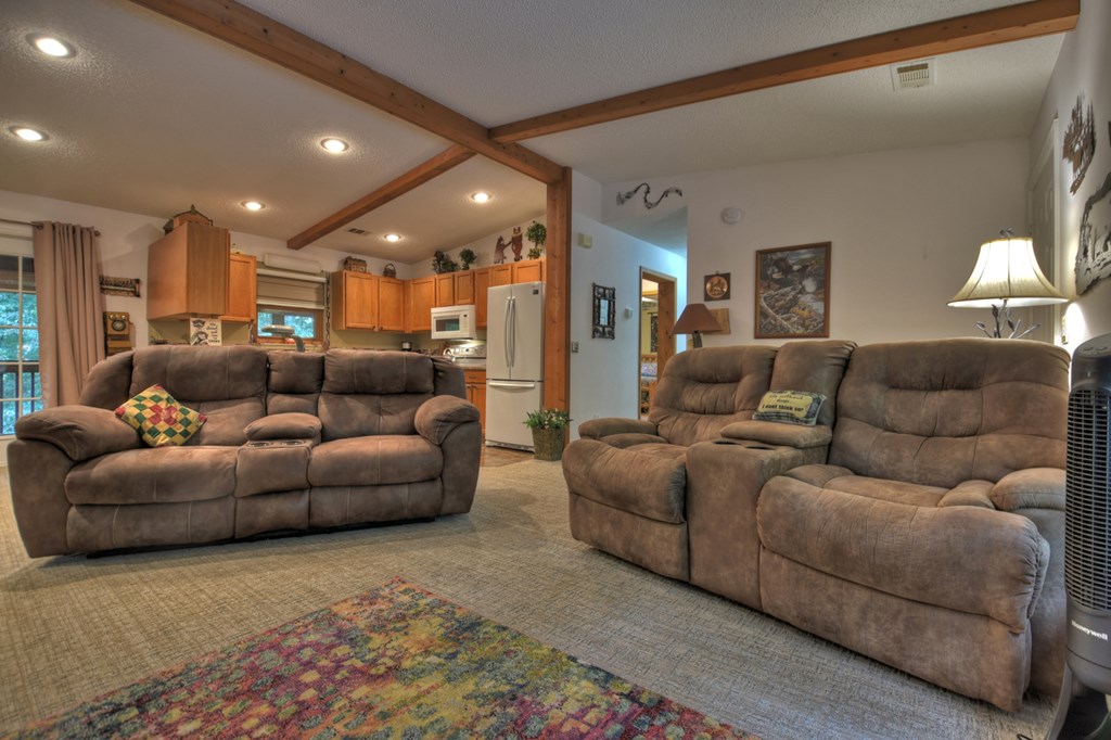 97 Mill Creek Acres Blue Ridge, GA 30513 - Photo 23 of 33 a living room with furniture and a window