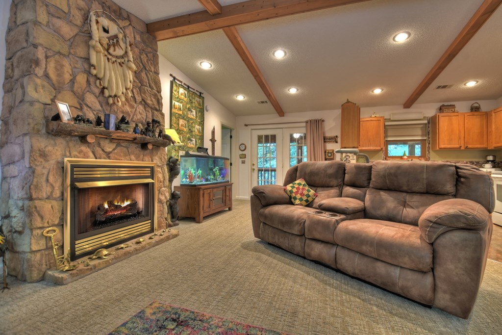 97 Mill Creek Acres Blue Ridge, GA 30513 - Photo 4 of 33 a living room with furniture and a fireplace