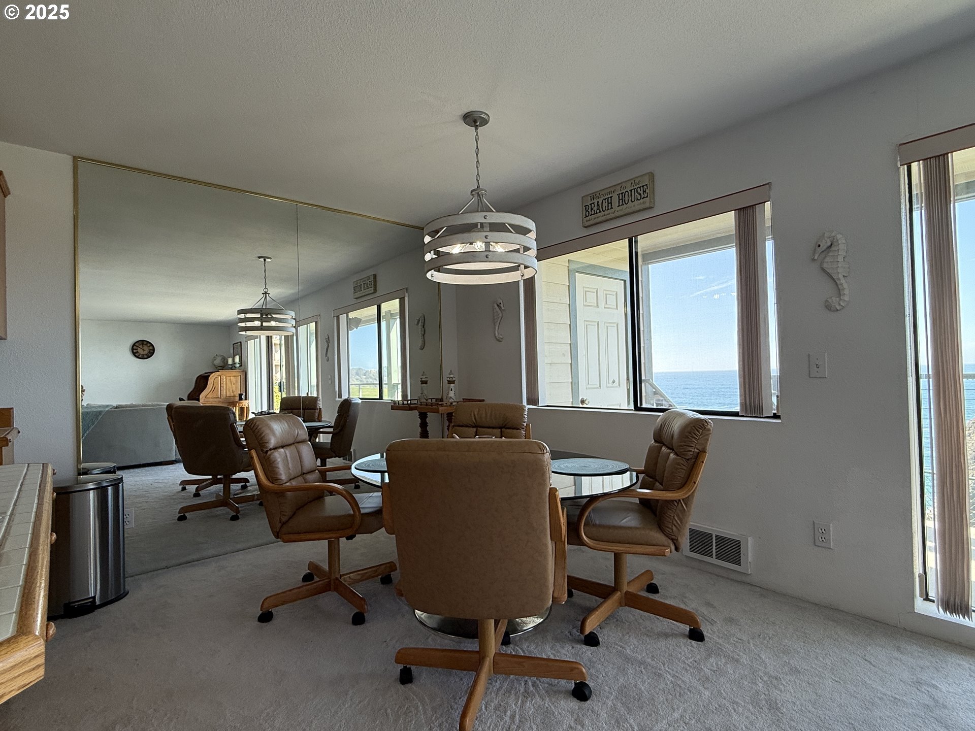 1305 Moore Street, Unit 402 Brookings, OR 97415 - Photo 11 of 28 a view of a livingroom with workspace and a window