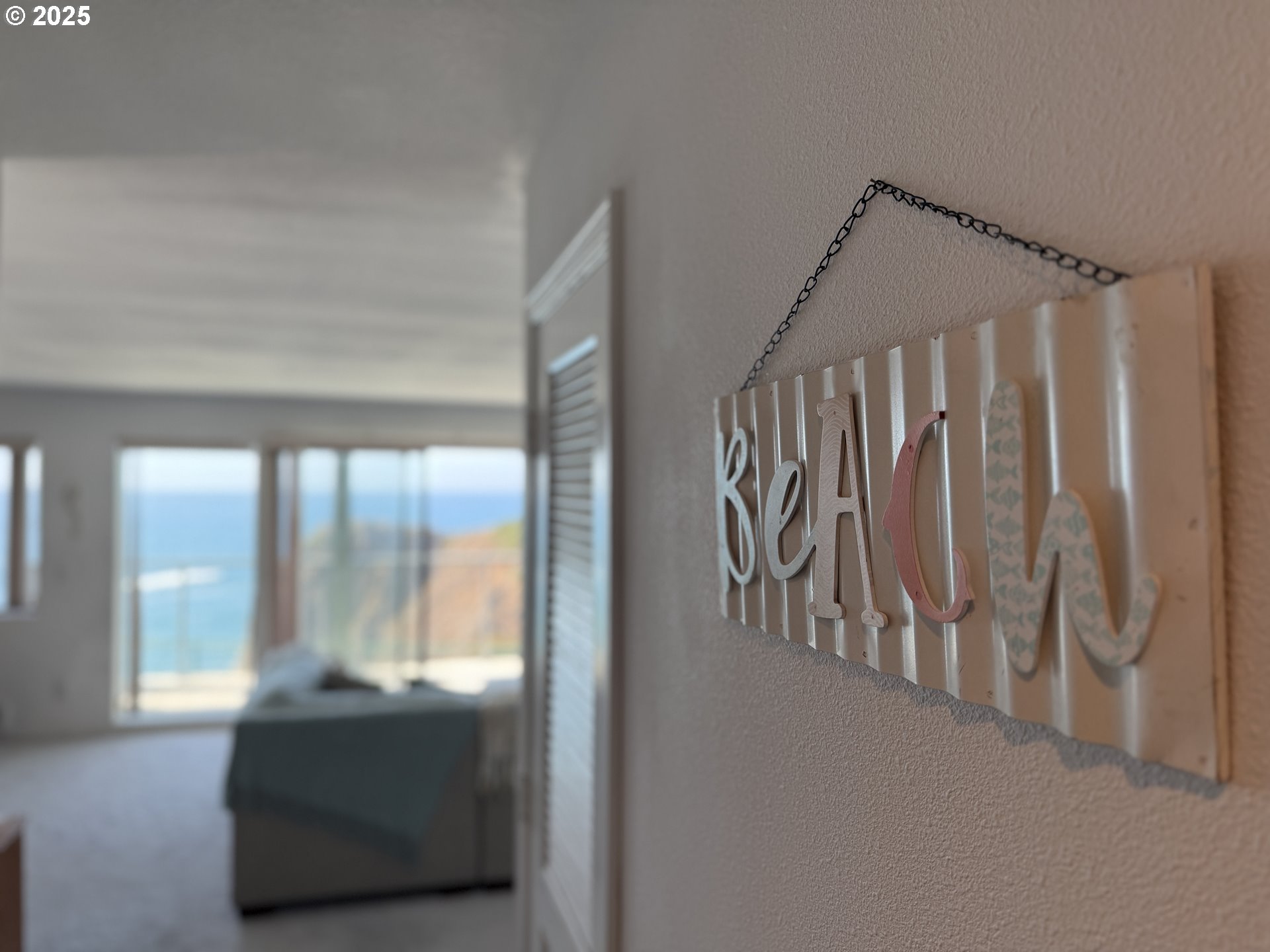 1305 Moore Street, Unit 402 Brookings, OR 97415 - Photo 16 of 28 a view of front door with hallway and stairs