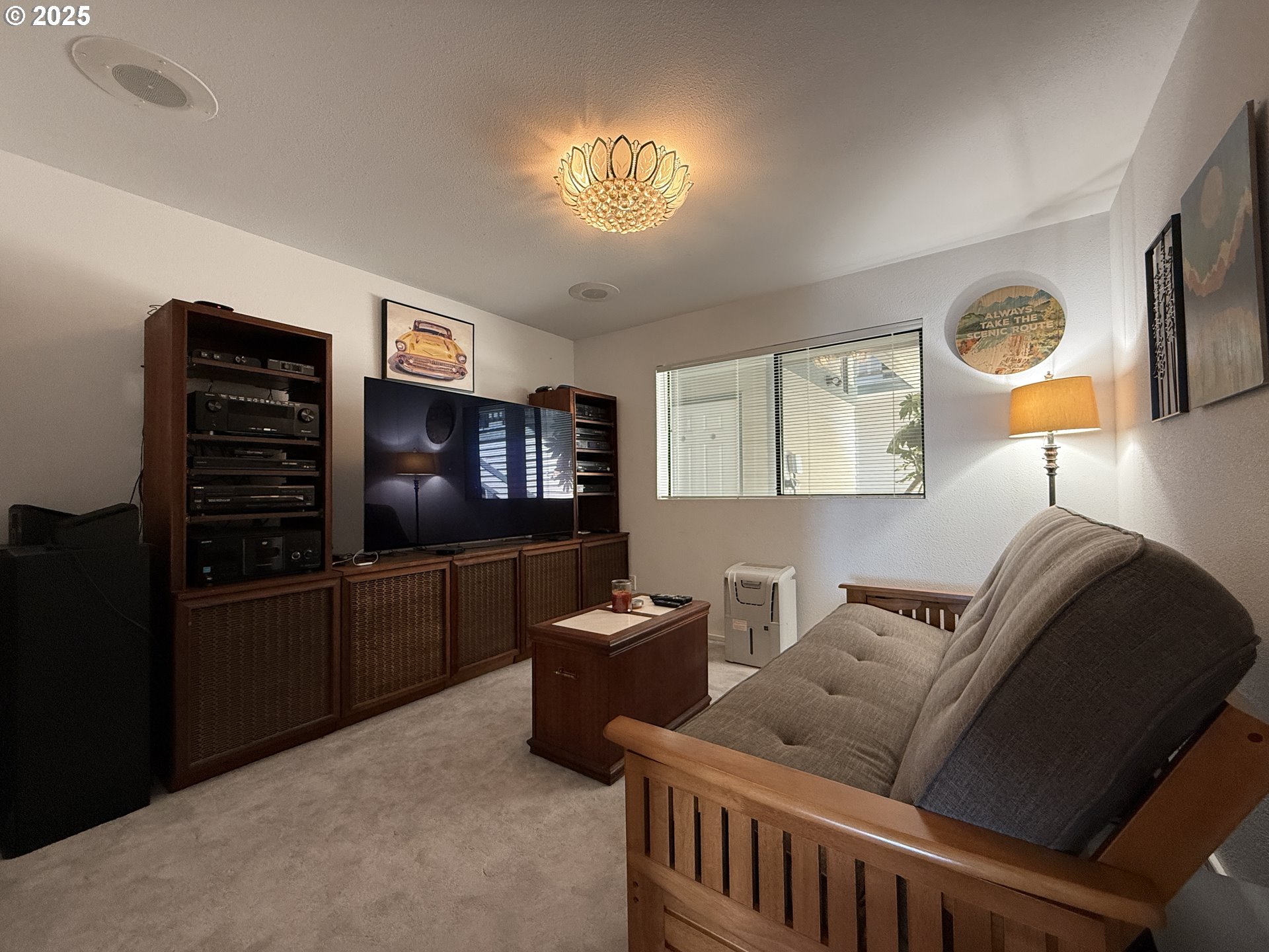 1305 Moore Street, Unit 402 Brookings, OR 97415 - Photo 23 of 28 a living room with furniture and a flat screen tv