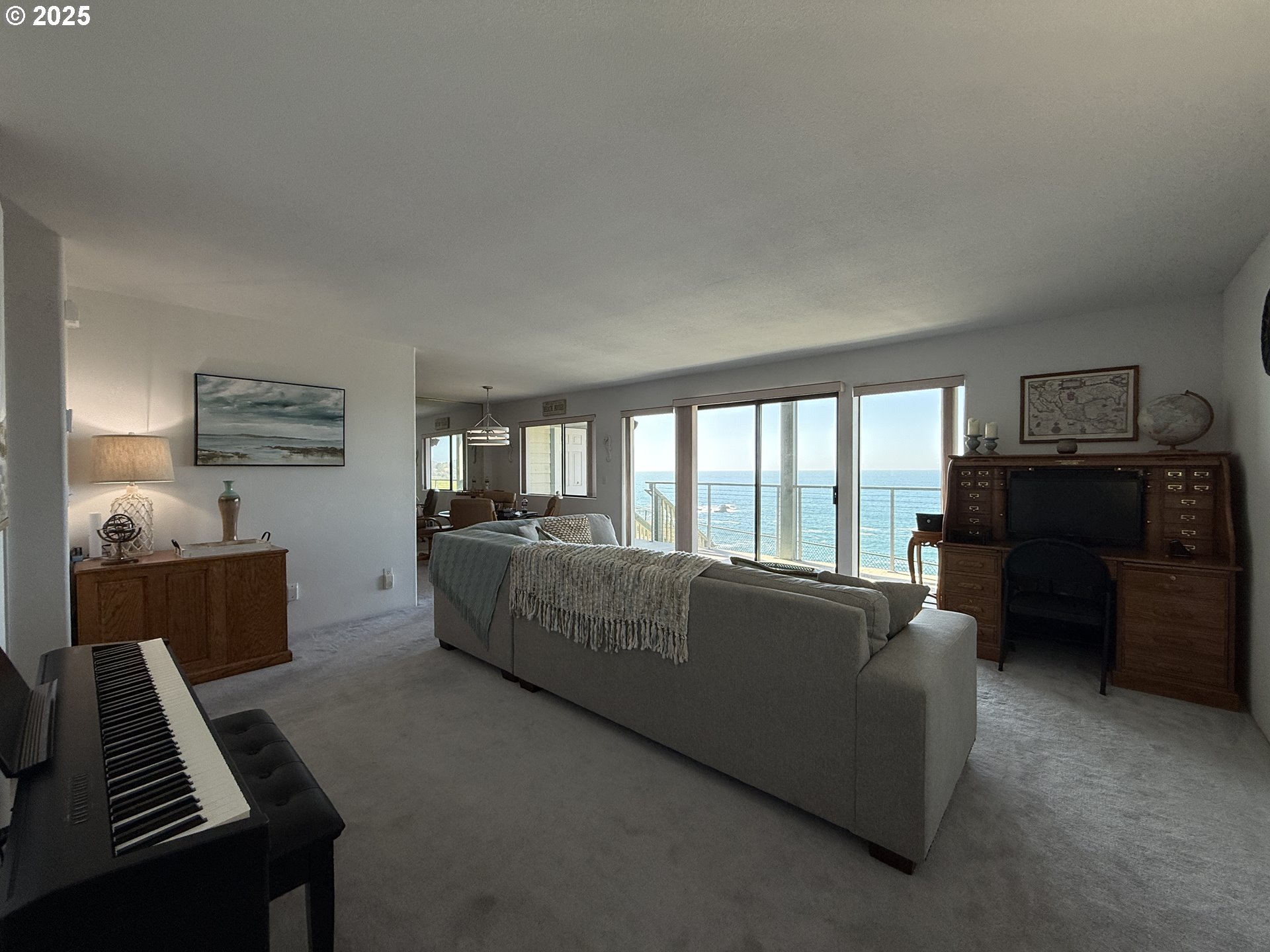 1305 Moore Street, Unit 402 Brookings, OR 97415 - Photo 7 of 28 a living room with furniture and a piano
