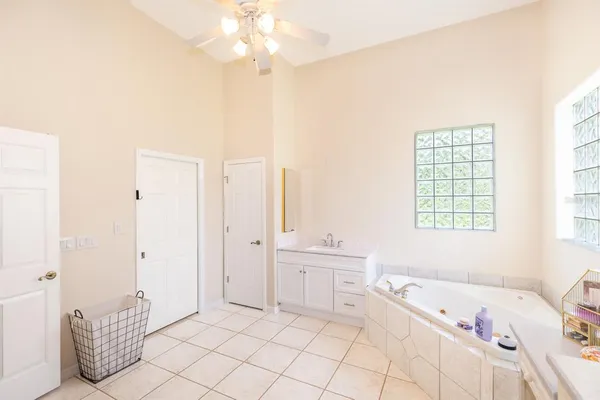 a room with a sink and a mirror