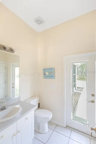 a bathroom with a toilet and shower