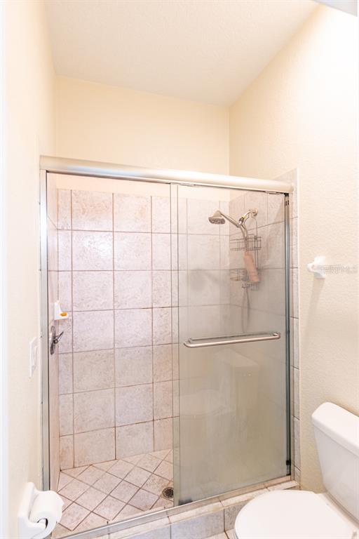 32025 Timberlake Drive Mount Dora, FL 32757 - Photo 26 of 55 a bathroom with a toilet and shower