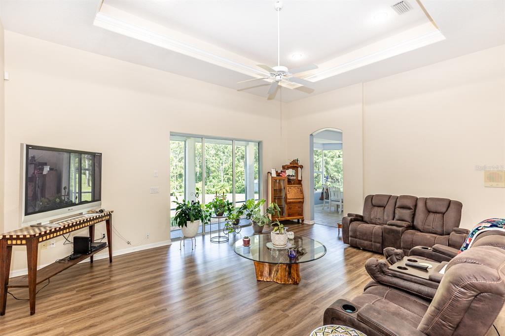 32025 Timberlake Drive Mount Dora, FL 32757 - Photo 34 of 55 a living room with furniture and a large window