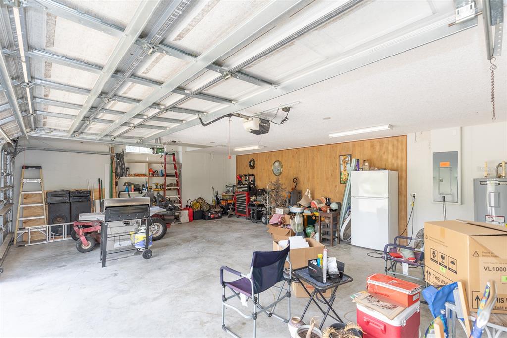 32025 Timberlake Drive Mount Dora, FL 32757 - Photo 42 of 55 a living room with furniture and a chandelier