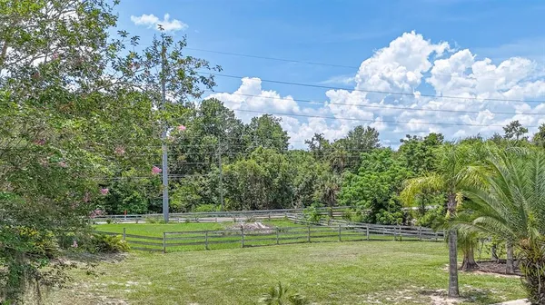 a backyard of a house with lots of green space