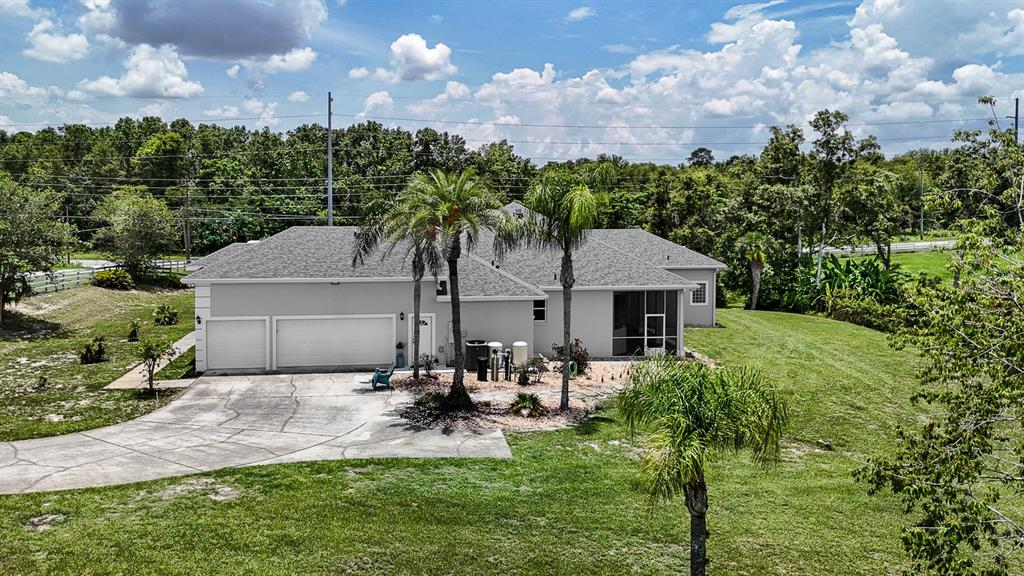 32025 Timberlake Drive Mount Dora, FL 32757 - Photo 5 of 55 a front view of a house with garden