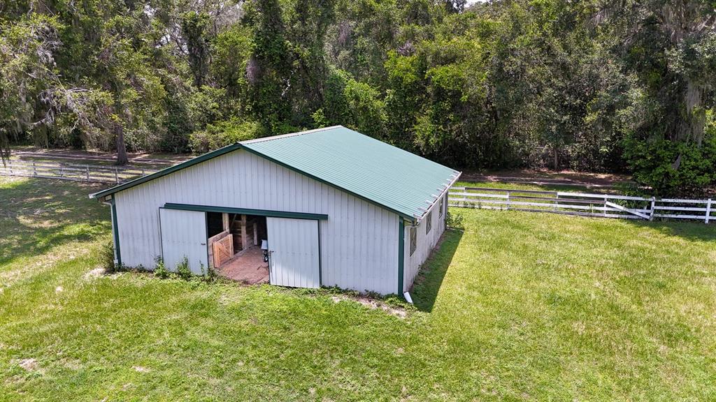 32025 Timberlake Drive Mount Dora, FL 32757 - Photo 9 of 55 a backyard of a house with lots of green space