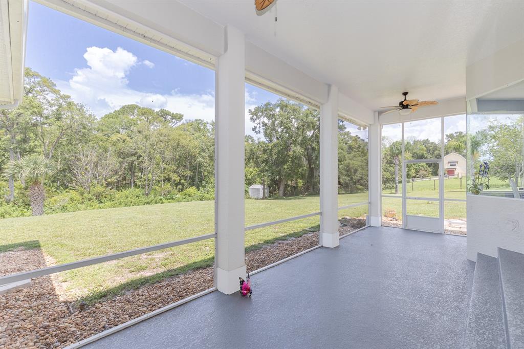 32025 Timberlake Drive Mount Dora, FL 32757 - Photo 10 of 55 a view of empty room with floor to ceiling window
