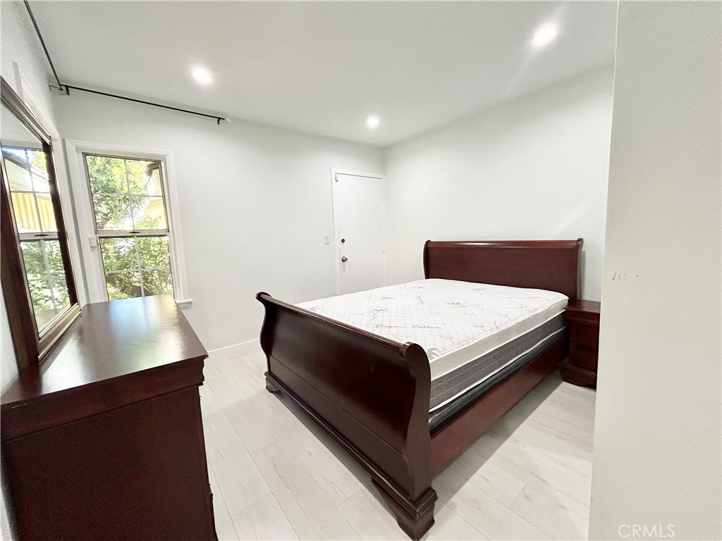 16754 Armstead Street Granada Hills, CA 91344 - Photo 11 of 28 a bed sitting in a spacious bedroom next to a window