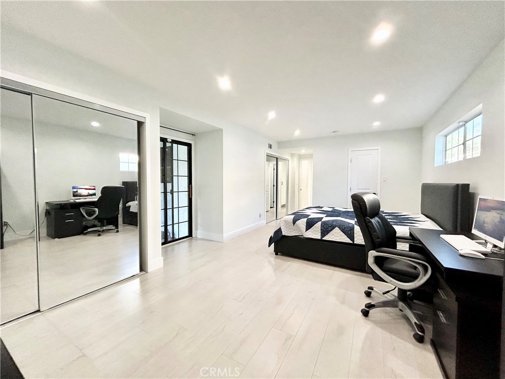 16754 Armstead Street Granada Hills, CA 91344 - Photo 15 of 28 a hotel room with a bed a couch and a view of kitchen