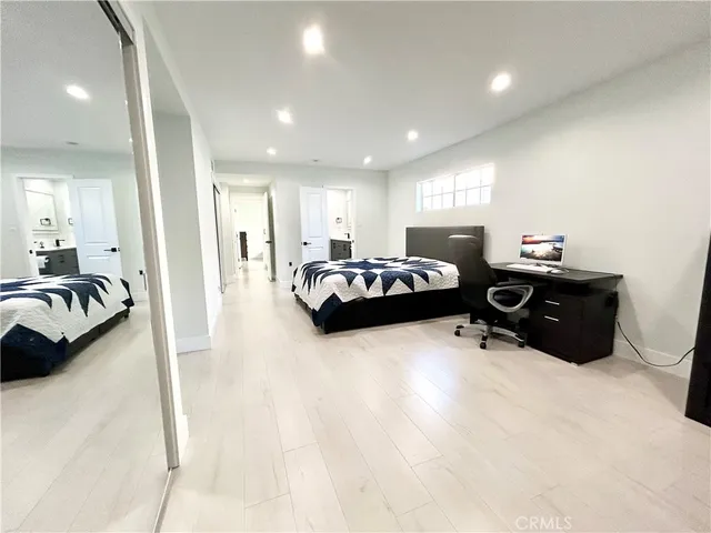 a bathroom with a double vanity sink toilet and shower