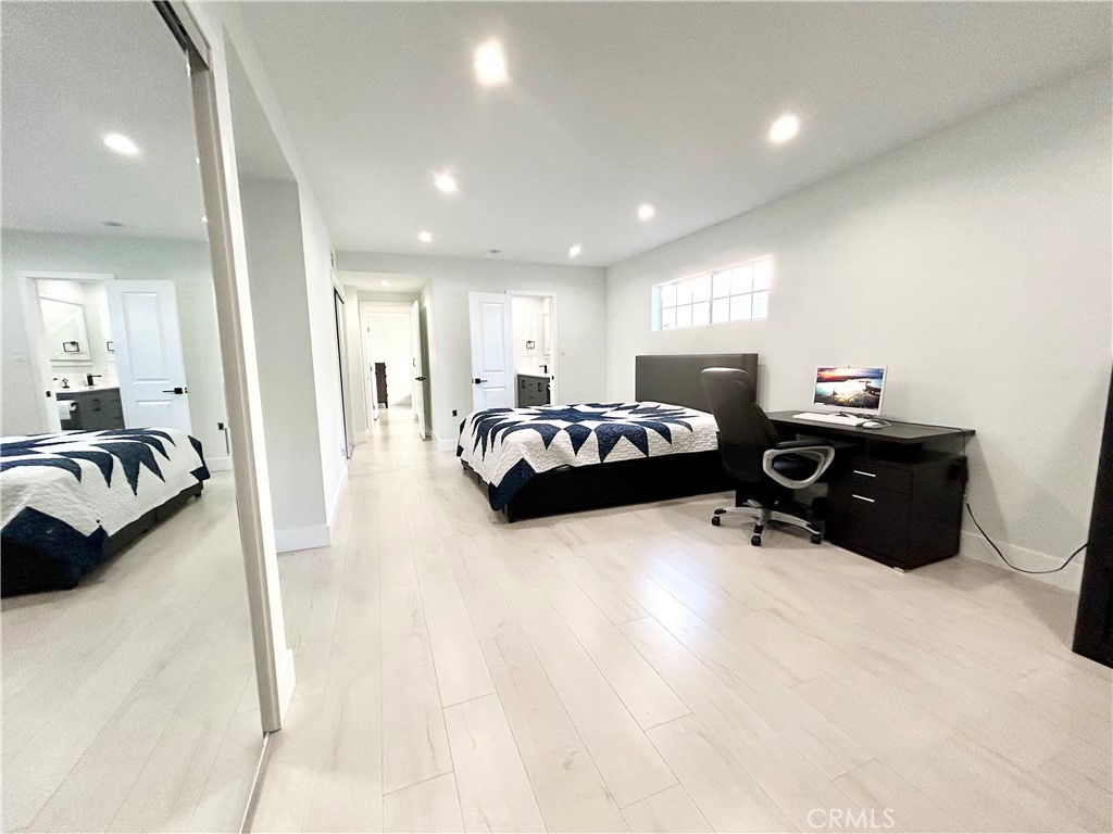 16754 Armstead Street Granada Hills, CA 91344 - Photo 16 of 28 a bedroom with furniture and a large window