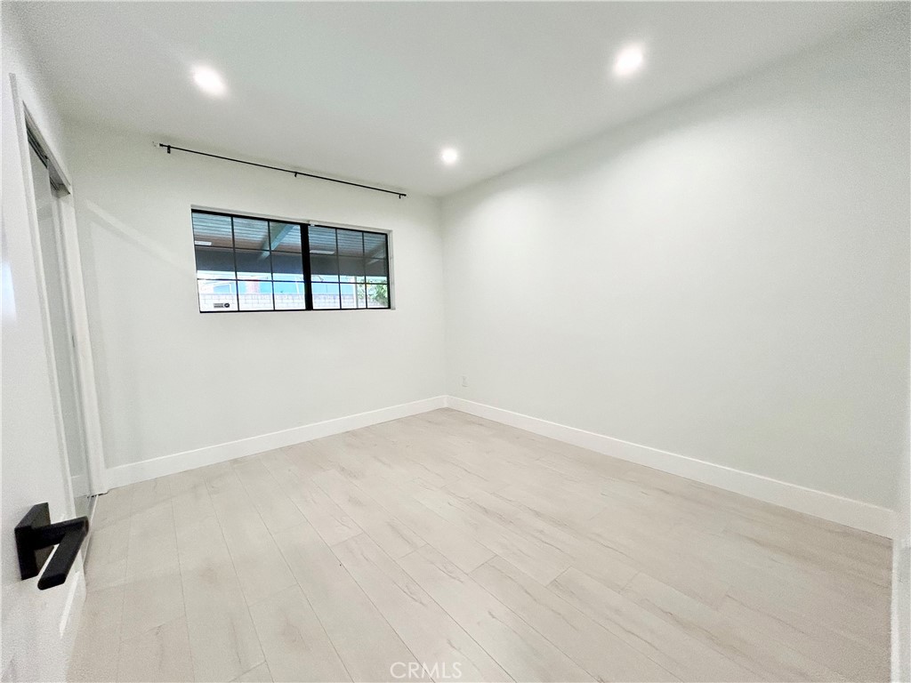 16754 Armstead Street Granada Hills, CA 91344 - Photo 19 of 28 an empty room with windows