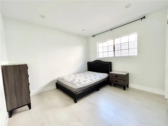 a view of a house with pool and chairs