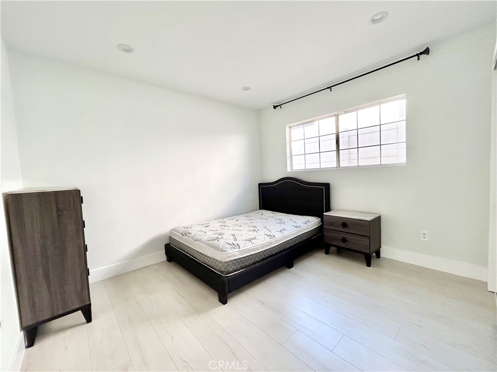 16754 Armstead Street Granada Hills, CA 91344 - Photo 21 of 28 a living room with furniture and window