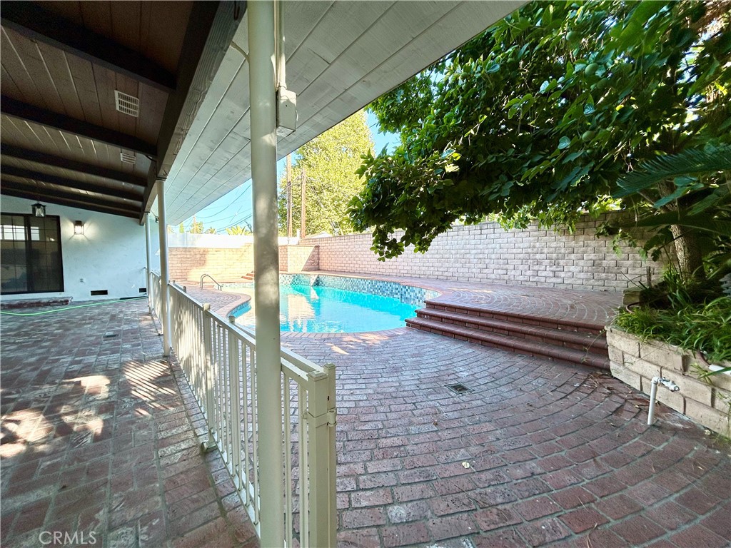 16754 Armstead Street Granada Hills, CA 91344 - Photo 23 of 28 a backyard of a house with lots of green space