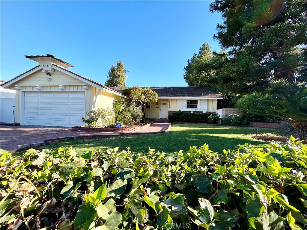 16754 Armstead Street Granada Hills, CA 91344 - Photo 28 of 28 a view of a house with a yard