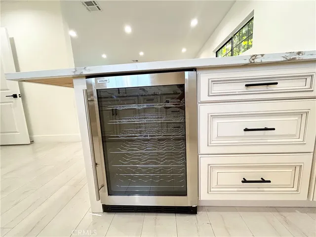 a view of walk in closet with clothes