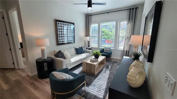 a living room with furniture and a window