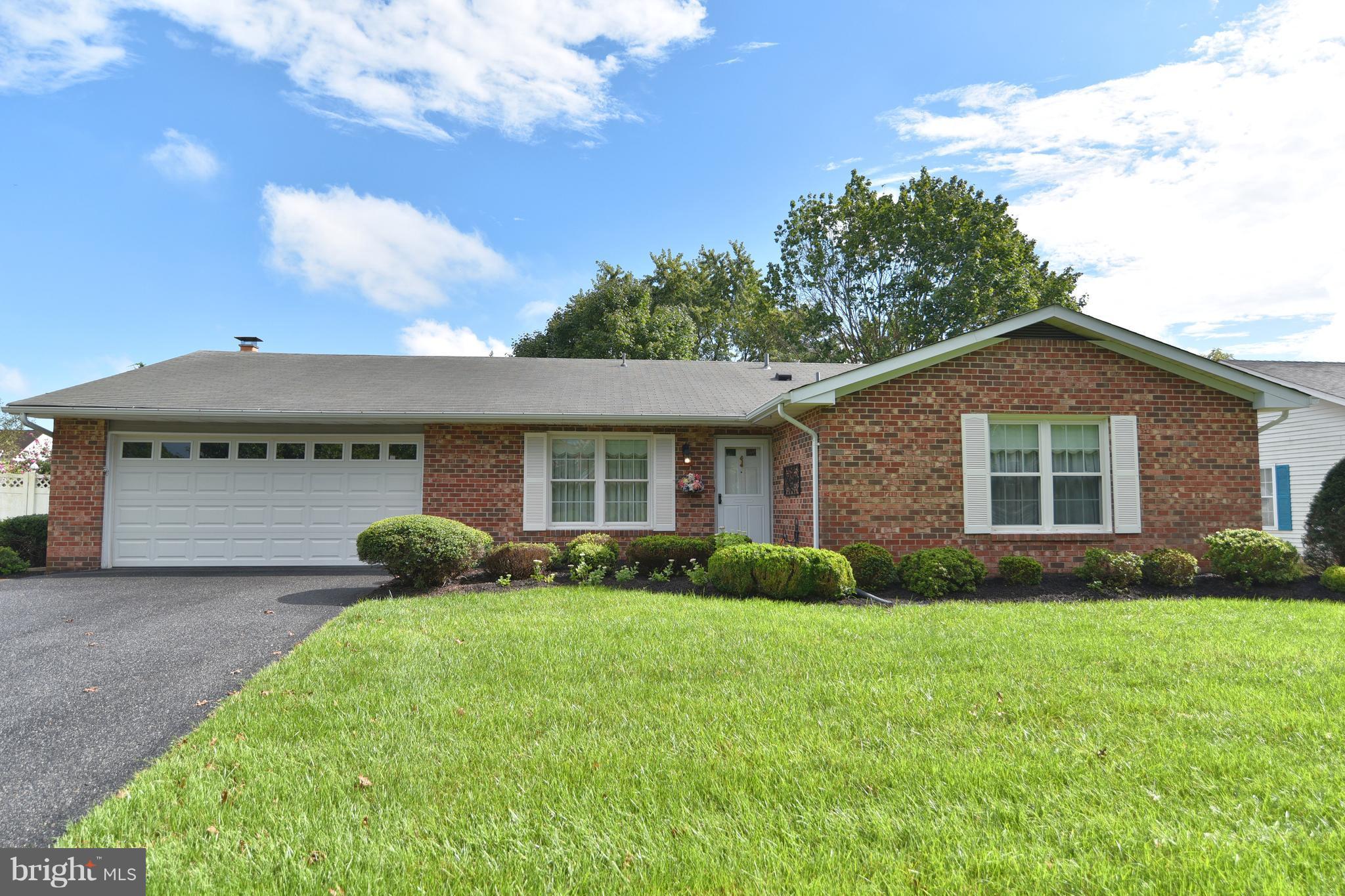 8219 Grainfield Road Severn, MD 21144 - Photo 1 of 30 a front view of a house with a yard and garage